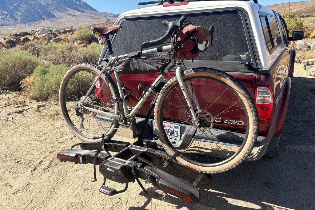 Car with mounted bike rack carrying bicycles securely for easy road trip transportation