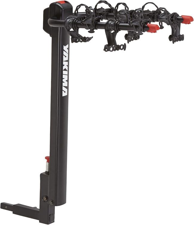 Yakima DoubleDown 4 hitch-mounted bike rack transporting four bicycles on an SUV, featuring a tilting design for rear vehicle access