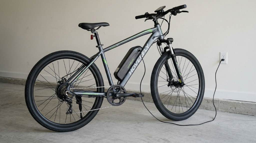 HOVERFLY OUREA 26″ Electric Bike battery charging on a wooden table