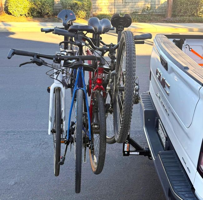 MaxxHaul hitch-mounted bike rack carrying multiple bikes
